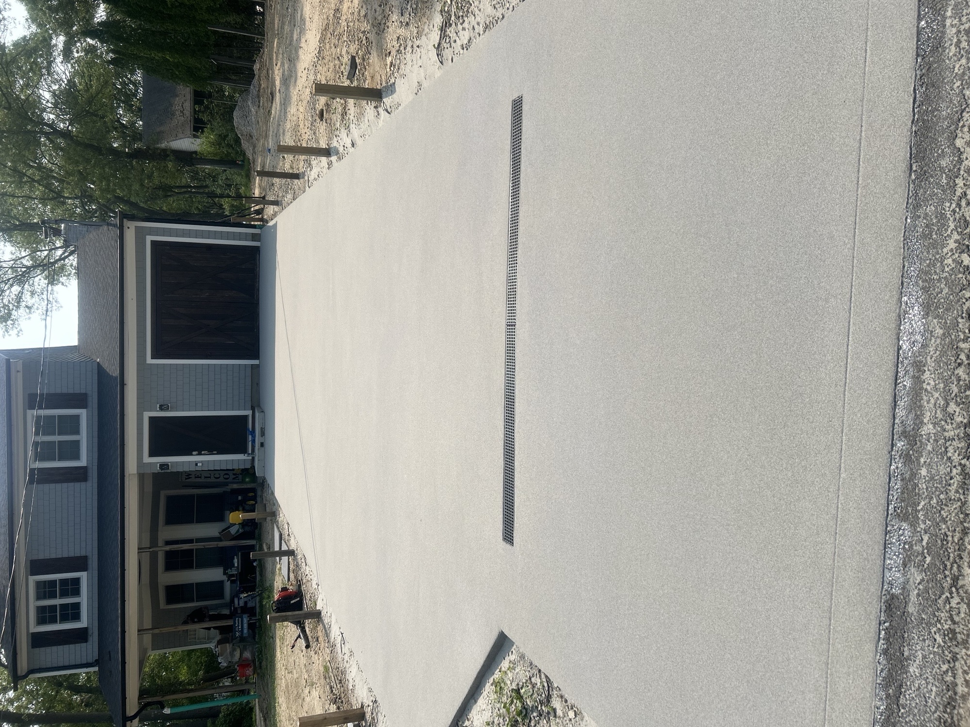 New concrete driveway with trench drain