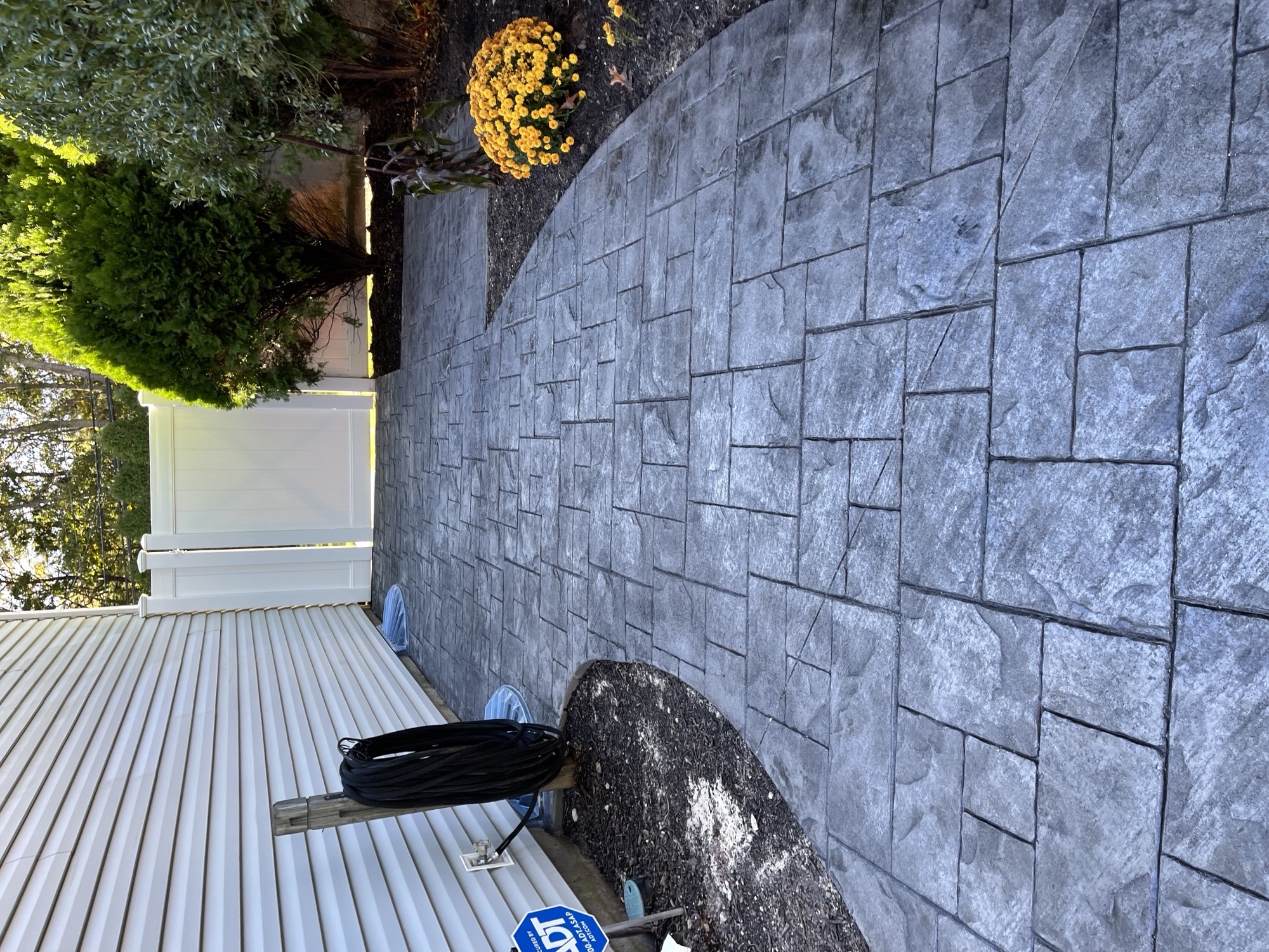 Stamped concrete side-yard walkway