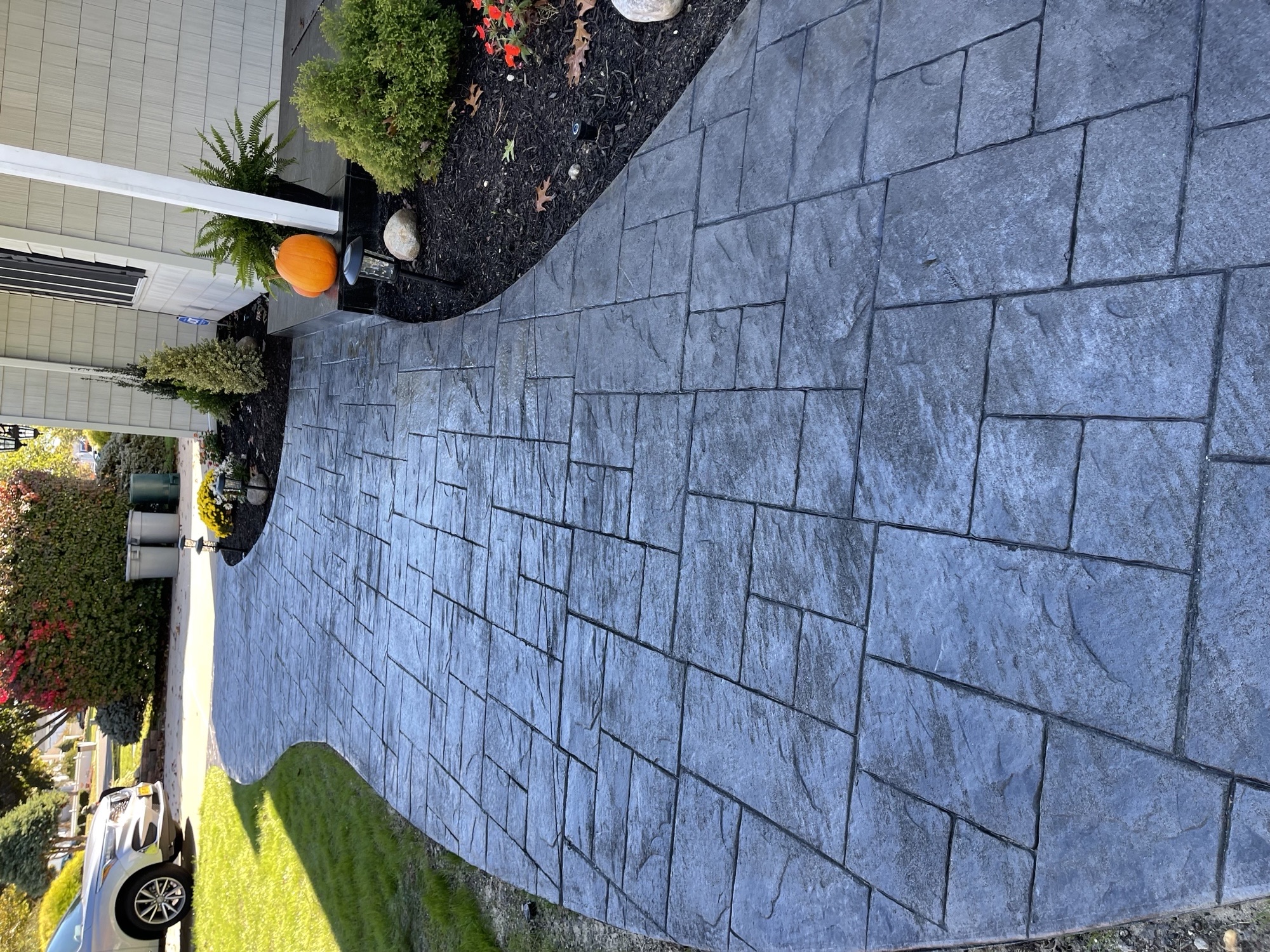 Curved stamped concrete entry walkway