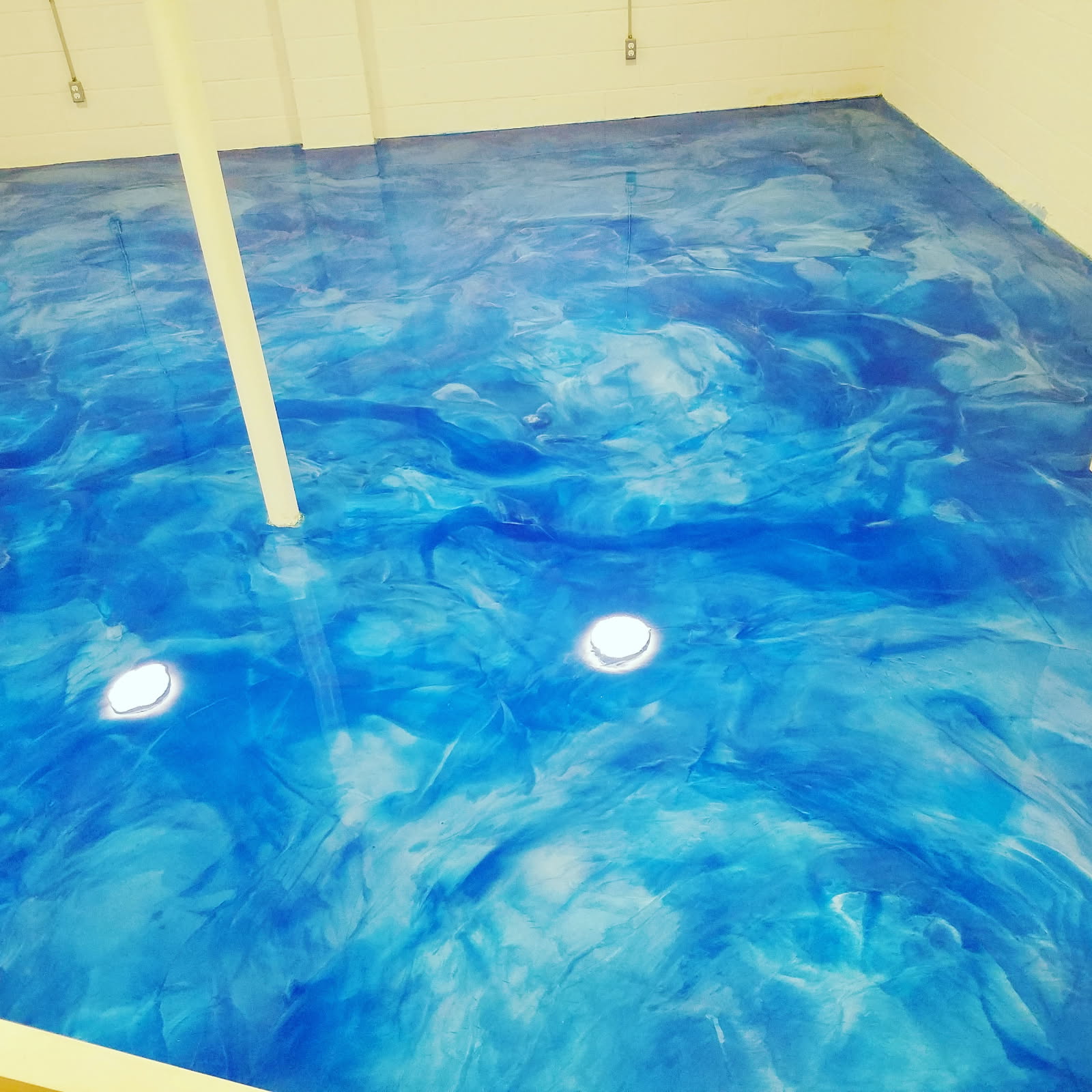 Ocean blue metallic epoxy basement floor
